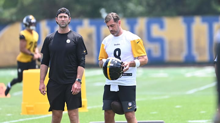 Pittsburgh Steelers quarterback Aaron Rodgers (8) puts on his helmet during minicamp at their South Side facility. Pittsburgh Steelers quarterback Aaron Rodgers (8) puts on his helmet during minicamp at their South Side facility.