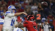 Nov 10, 2024; Houston, Texas, USA; Detroit Lions quarterback Jared Goff (16) throws an incomplete pass as he is pressured by Houston Texans safety Jalen Pitre (5) in the second quarter at NRG Stadium. Mandatory Credit: Thomas B. Shea-Imagn Images