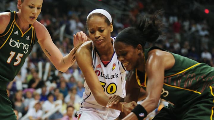 Sep 5, 2010; Phoenix, AZ, USA; Phoenix Mercury forward Tangela Smith (50) fights for a lose ball with Seattle Storm forward Swin Cash (2) and forward Lauren Jackson (15) during the first half in game two of the western conference finals in the 2010 WNBA Playoffs at US Airways Center.  The Storm defeated the Mercury 91-88.  Mandatory Credit: Jennifer Stewart-Imagn Images