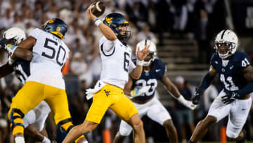 West Virginia quarterback Garrett Greene (6) passes during a 2023 football game against Penn State at Beaver Stadium.