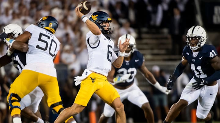 West Virginia quarterback Garrett Greene (6) passes during a 2023 football game against Penn State at Beaver Stadium.