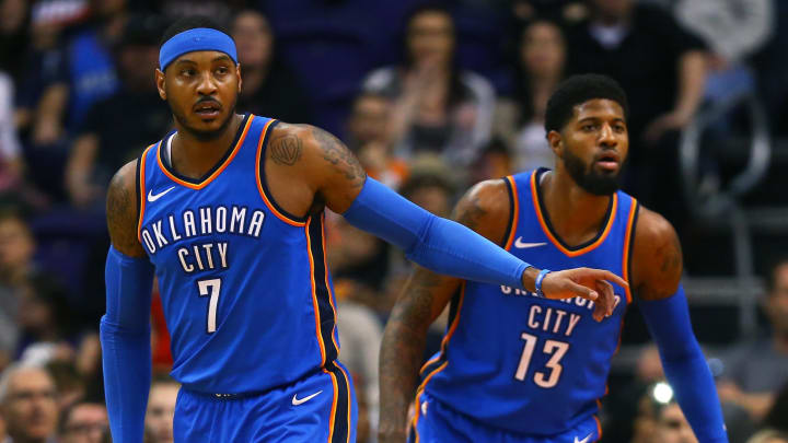 Mar 2, 2018; Phoenix, AZ, USA; Oklahoma City Thunder forward Carmelo Anthony (7) and forward Paul George (13) against the Phoenix Suns at Talking Stick Resort Arena. Mandatory Credit: Mark J. Rebilas-USA TODAY Sports