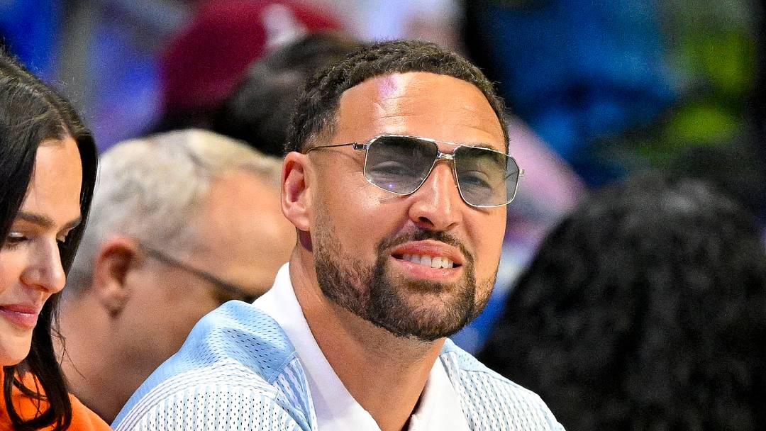 Jun 20, 2026; Arlington, Texas, USA; Dallas Mavericks guard Klay Thompson watches the game between the Dallas Wings and the Chicago Sky during the first half at College Park Center. Mandatory Credit: Jerome Miron-Imagn Images