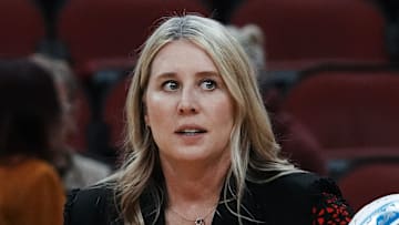 Louisville head coach Dani Busboom Kelly helps her team warm up ahead of their Final Four match against Pittsburgh at the KFC Yum! Center in Louisville, Ky. on Dec. 19, 2024.