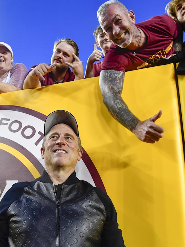 Washington Commanders owner Josh Harris with fans.