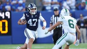 Aug 30, 2025; Provo, Utah, USA; Brigham Young Cougars quarterback Bear Bachmeier (47) runs against Portland State Vikings linebacker Jaxton Helmstetler (6) during the second quarter at LaVell Edwards Stadium. Mandatory Credit: Rob Gray-Imagn Images