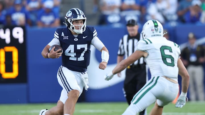 Aug 30, 2025; Provo, Utah, USA; Brigham Young Cougars quarterback Bear Bachmeier (47) runs against Portland State Vikings linebacker Jaxton Helmstetler (6) during the second quarter at LaVell Edwards Stadium. Mandatory Credit: Rob Gray-Imagn Images