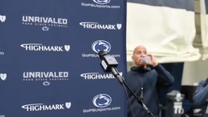James Franklin takes a step back from the podium during his own press conference. 
