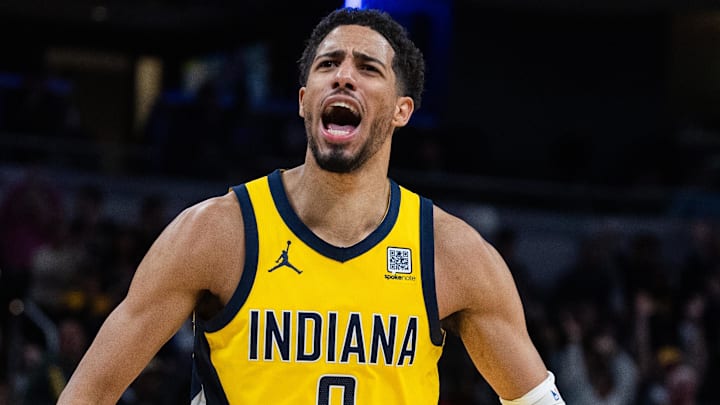 Mar 31, 2025; Indianapolis, Indiana, USA; Indiana Pacers guard Tyrese Haliburton (0) celebrates the game winning basket in the second half against the Sacramento Kings at Gainbridge Fieldhouse. Mandatory Credit: Trevor Ruszkowski-Imagn Images