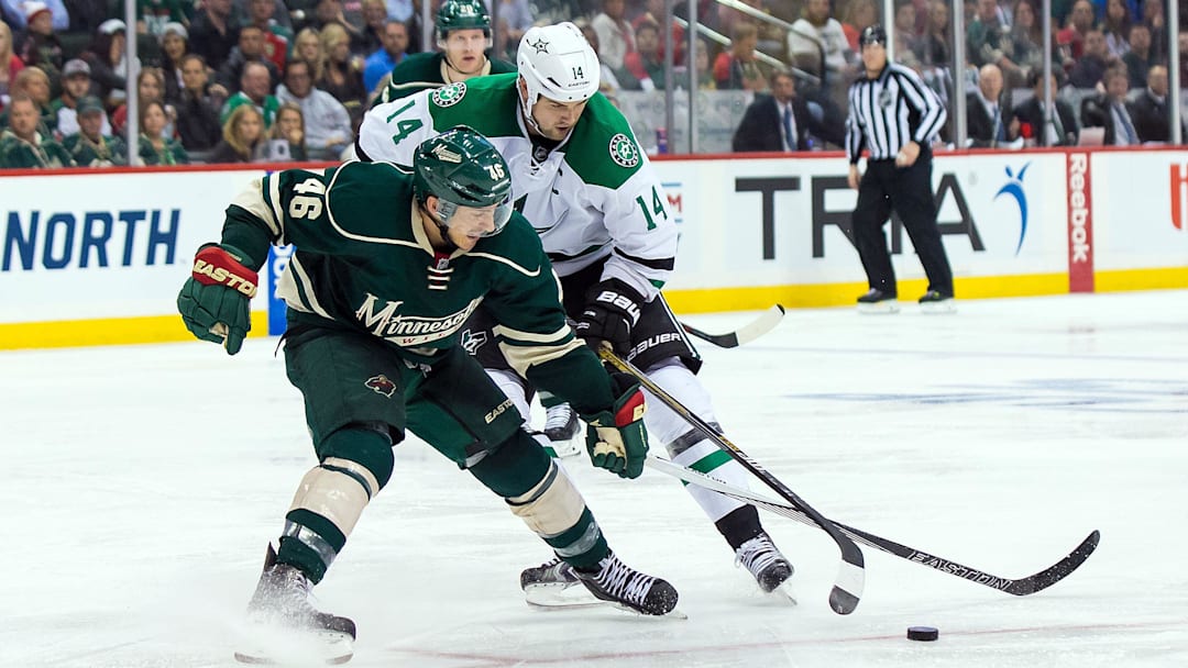 Apr 18, 2016; Saint Paul, MN, USA; Minnesota Wild defenseman Jared Spurgeon (46) defends Dallas Stars forward Jamie Benn (14) in the third period in game three of the first round of the 2016 Stanley Cup Playoffs at Xcel Energy Center. The Minnesota Wild beat the Dallas Stars 5-3. Mandatory Credit: Brad Rempel-Imagn Images