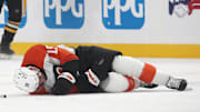 Feb 27, 2025; Pittsburgh, Pennsylvania, USA;  Philadelphia Flyers right wing Garnet Hathaway (19) lays on the ice after suffering an apparent injury after being hit by Pittsburgh Penguins left wing Bokondji Imama (not pictured) during the second period at PPG Paints Arena. Mandatory Credit: Charles LeClaire-Imagn Images