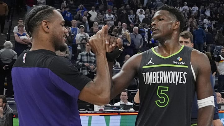 Mar 28, 2025; Minneapolis, Minnesota, USA; Minnesota Timberwolves guard Anthony Edwards (5) greets Phoenix Suns guard Monte Morris (23) after the game at Target Center. Mandatory Credit: Bruce Kluckhohn-Imagn Images