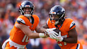Sep 7, 2025; Denver, Colorado, USA; Denver Broncos running back J.K. Dobbins (27) receives a hand off from quarterback Bo Nix (10) during the second half at Empower Field at Mile High.