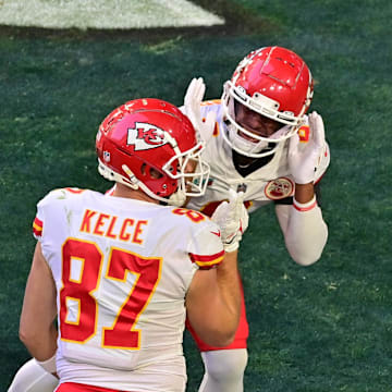 Feb 12, 2023; Glendale, Arizona, US; Kansas City Chiefs tight end Travis Kelce (87) celebrates with quarterback Patrick Mahomes (15) and other teammates after catching a pass for a touchdown against the Philadelphia Eagles during the first quarter of Super Bowl LVII at State Farm Stadium. Mandatory Credit: Matt Kartozian-Imagn Images