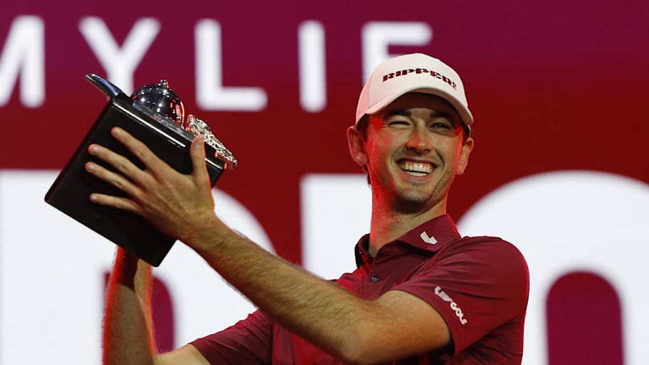 Elvis Smylie celebrates with the trophy after winning during the final round of play at 2026 LIV Golf Riyadh.