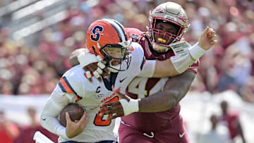 Oct 14, 2023; Tallahassee, Florida, USA; Florida State Seminoles defensive lineman Joshua Farmer (44) sacks Syracuse Orange quarterback Garrett Shrader (6) during the first half at Doak S. Campbell Stadium. Mandatory Credit: Melina Myers-Imagn Images