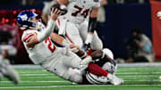Nov 28, 2024; Arlington, Texas, USA;  New York Giants quarterback Drew Lock (2) is sacked by Dallas Cowboys defensive end Carl Lawson (55) during the second half at AT&T Stadium. Mandatory Credit: Chris Jones-Imagn Images