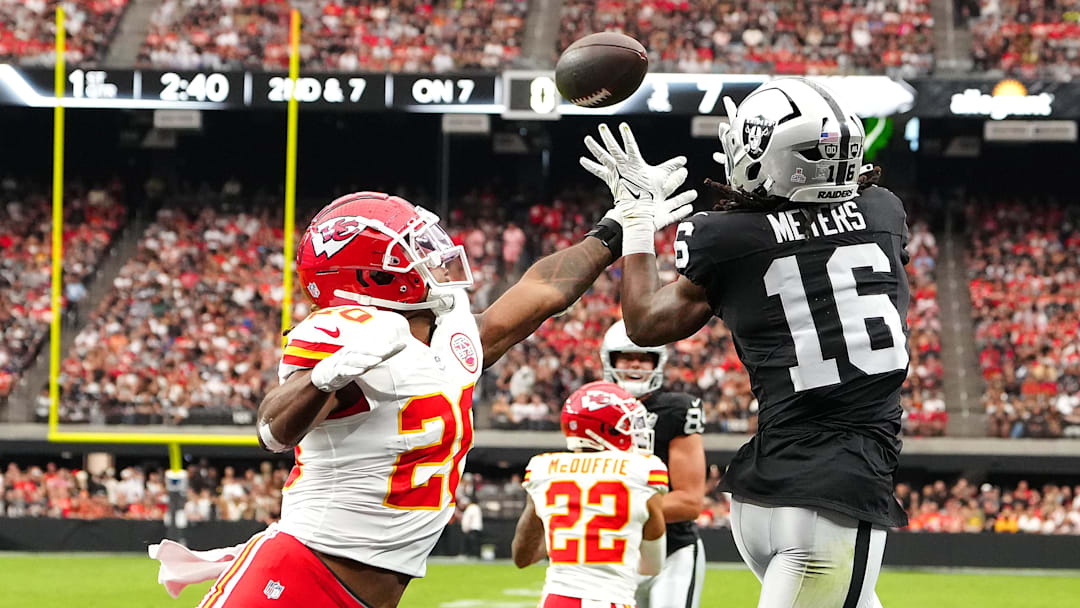 Oct 27, 2024; Paradise, Nevada, USA; Las Vegas Raiders wide receiver Jakobi Meyers (16) makes a touchdown catch next to Kansas City Chiefs safety Justin Reid (20) during the first quarter at Allegiant Stadium. Mandatory Credit: Stephen R. Sylvanie-Imagn Images Oct 27, 2024; Paradise, Nevada, USA; Las Vegas Raiders wide receiver Jakobi Meyers (16) makes a touchdown catch next to Kansas City Chiefs safety Justin Reid (20) during the first quarter at Allegiant Stadium. Mandatory Credit: Stephen R. Sylvanie-Imagn Images