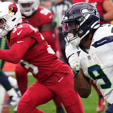 Jan 7, 2024; Glendale, Arizona, USA; Seattle Seahawks running back Kenneth Walker III (9) runs against the Arizona Cardinals during the first half at State Farm Stadium. Mandatory Credit: Joe Camporeale-Imagn Images