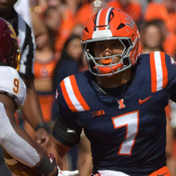 Sep 14, 2024; Champaign, Illinois, USA;  Illinois Fighting Illini defensive back Matthew Bailey (7) pursues Central Michigan Chippewas wide receiver Jordyn Williams (18) during the first half at Memorial Stadium. Mandatory Credit: Ron Johnson-Imagn Images