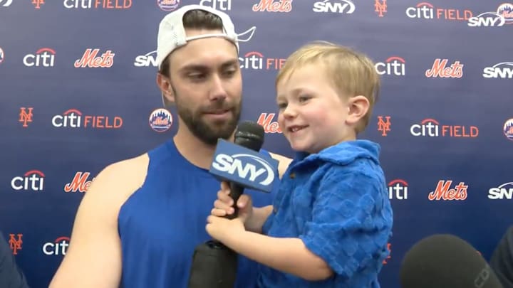 David Peterson and his son answer questions after the Mets win over the Brewers.