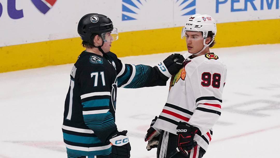 Apr 6, 2026; San Jose, California, USA;  San Jose Sharks center Macklin Celebrini (71) and Chicago Blackhawks center Connor Bedard (98) meet during a break in the action in the third period at SAP Center at San Jose. Mandatory Credit: David Gonzales-Imagn Images