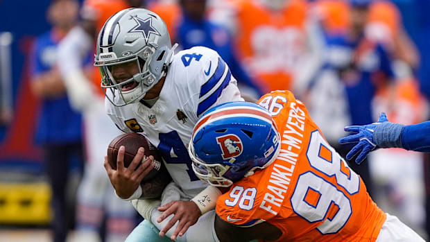 allas Cowboys quarterback Dak Prescott (4) is sacked by Denver Broncos defensive end John Franklin-Myers (98). 