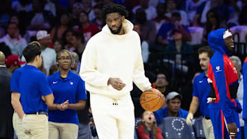 Philadelphia 76ers center Joel Embiid dribbles the ball/