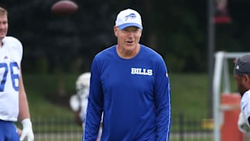 Buffalo Bills offensive line coach Aaron Kromer works with lineman Tylan Grable before the start of the Buffalo Bills training camp.