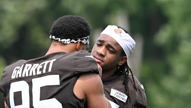 Cleveland Browns defensive end Isaiah McGuire (57) talks with defensive end Myles Garrett