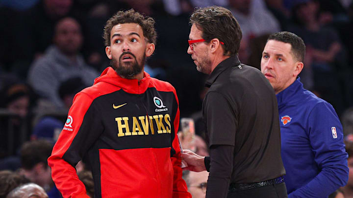 Jan 20, 2025; New York, New York, USA; Atlanta Hawks guard Trae Young (11) talks with head coach Quin Snyder during the first half against the New York Knicks at Madison Square Garden. Mandatory Credit: Vincent Carchietta-Imagn Images