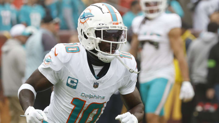 Dec 3, 2023; Landover, Maryland, USA; Miami Dolphins wide receiver Tyreek Hill (10) on the field during warm up prior to the game against the Washington Commanders at FedExField. Mandatory Credit: Geoff Burke-USA TODAY Sports