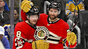 Chicago Blackhawks center Ryan Donato celebrates with defenseman TJ Brodie after scoring against the St. Louis Blues.