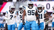 Nov 16, 2025; Atlanta, Georgia, USA; Carolina Panthers defensive tackle Derrick Brown (95) looks on in between plays in the first quarter against the Atlanta Falcons at Mercedes-Benz Stadium.