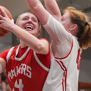 Kimberly's Ava Van Vonderen (34) battles for a shot against Pewaukee's Anna Terrian (45) during the WIAA Division 1 sectional final game Saturday, March 8, 2025. 