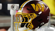 Nov 2, 2025; Landover, Maryland, USA; A Washington Commanders player's helmet on the bench during the game against the Seattle Seahawks at Northwest Stadium. Mandatory Credit: Geoff Burke-Imagn Images