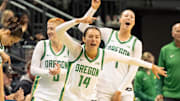 Oregon’s bench celebrates a foul as the Oregon Ducks host the Western Oregon Wolves in an exhibition game at Matthew Knight Arena in Eugene on Oct. 30, 2025.