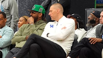 July 19, 2025; North Augusta, South Carolina, USA; NBA star Carmelo Anthony (center right) talks to University of Kentucky basketball coach Mark Pope (right) during the Team Why Not and Team CP3 game at the Nike EYBL Peach Jam at Riverview Park Activity Center. Team Why Not won 66-63. Mandatory Credit: Katie Goodale - Augusta Chronicle/USA TODAY NETWORK