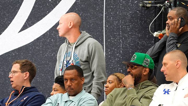 July 19, 2025; North Augusta, South Carolina, USA; NBA star Carmelo Anthony (center right) talks to University of Kentucky basketball coach Mark Pope (right) during the Team Why Not and Team CP3 game at the Nike EYBL Peach Jam at Riverview Park Activity Center. Team Why Not won 66-63. Mandatory Credit: Katie Goodale - Augusta Chronicle/USA TODAY NETWORK