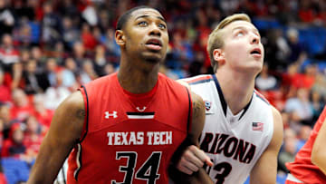 Dec 3, 2013; Tucson, AZ, USA; Texas Tech Red Raiders forward Alex Foster (34) and Arizona Wildcats forward Zach Peters (33) battle for positioning during a free throw attempt during the second half at McKale Center. Arizona defeated Texas Tech 79-58. Mandatory Credit: Casey Sapio-Imagn Images