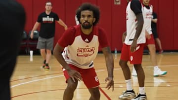 Tayton Conerway closes in to defend an inbounds pass during a recent Indiana men's basketball workout at Cook Hall.