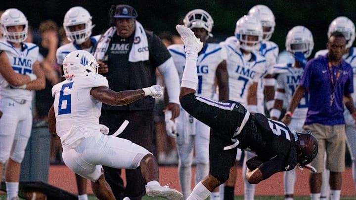 IMG's Gavin Nix (6) trips up Lipscomb's Micah Burton (15) after a catch at Lipscomb's Reese Smith Football Field in Nashville, Tenn., Friday night, Aug. 18, 2023. IMG went on to win the game 35-10.