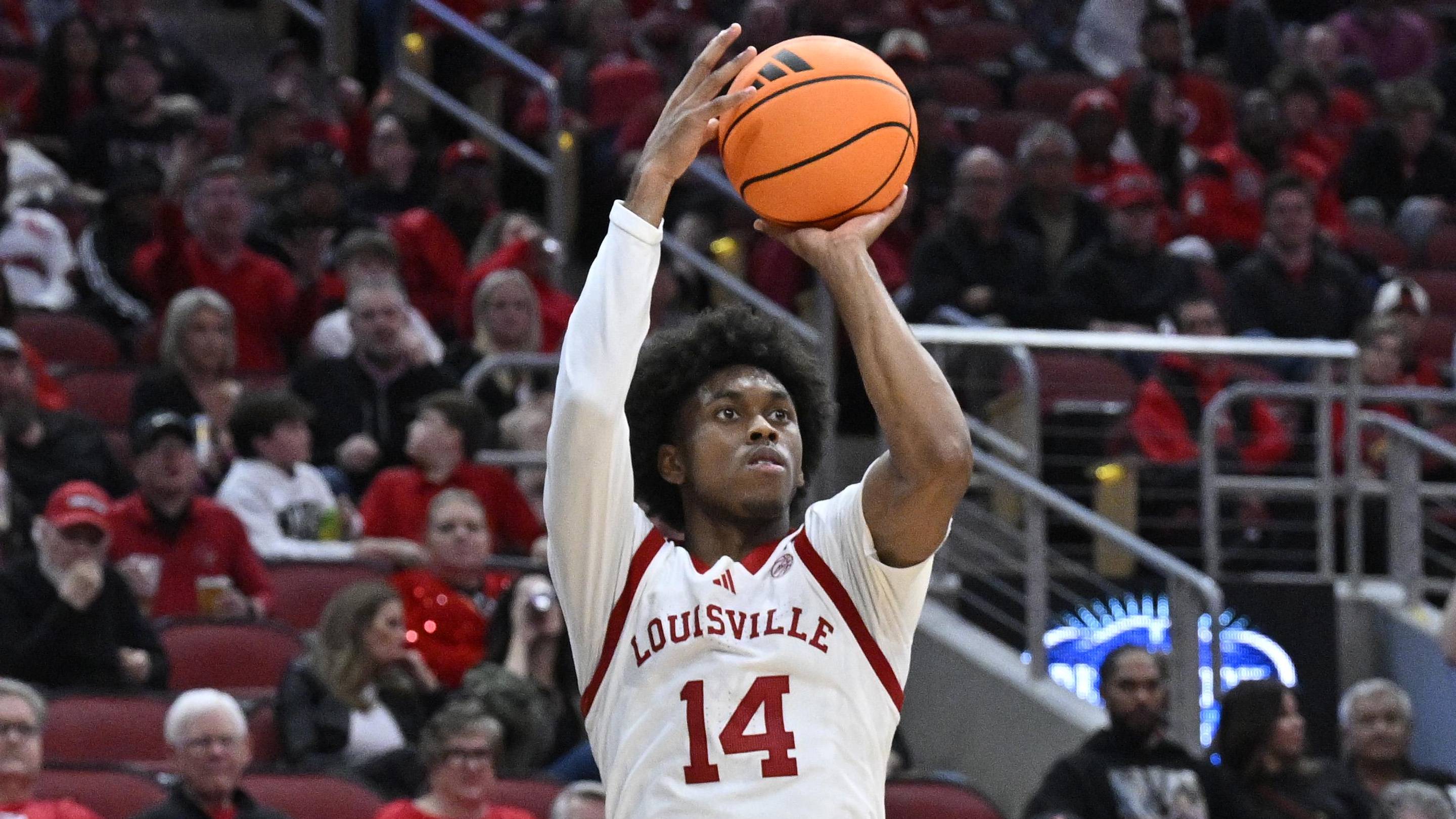 Mar 3, 2026; Louisville, Kentucky, USA; Louisville Cardinals guard Adrian Wooley (14) shoots against the Syracuse Orange during the second half at KFC Yum! Center. Louisville defeated Syracuse 77-62. Mandatory Credit: Jamie Rhodes-Imagn Images
