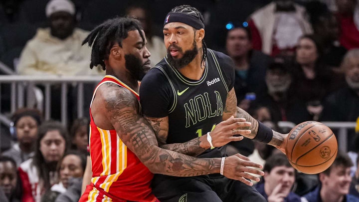 Mar 10, 2024; Atlanta, Georgia, USA; New Orleans Pelicans forward Brandon Ingram (14) dribbles guarded by Atlanta Hawks forward Saddiq Bey (41) during the first half at State Farm Arena.