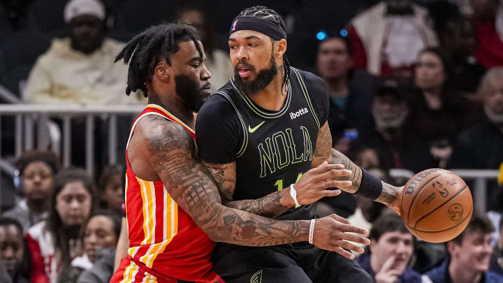 Mar 10, 2024; Atlanta, Georgia, USA; New Orleans Pelicans forward Brandon Ingram (14) dribbles guarded by Atlanta Hawks forward Saddiq Bey (41) during the first half at State Farm Arena.