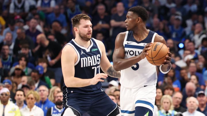 May 28, 2024; Dallas, Texas, USA; Minnesota Timberwolves guard Anthony Edwards (5) controls the ball against Dallas Mavericks guard Luka Doncic (77) during the third quarter of game four of the western conference finals for the 2024 NBA playoffs at American Airlines Center. Mandatory Credit: Kevin Jairaj-USA TODAY Sports