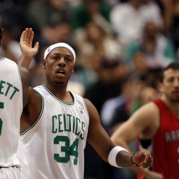 Oct 14, 2009; Hartford, CT, USA; Boston Celtics forward Paul Pierce (34) reacts with teammate forward Kevin Garnett (5) as they take on the Toronto Raptors during the seond quarter at the XL Center. Mandatory Credit: David Butler II-USA TODAY Sports