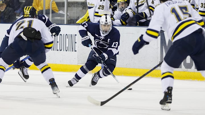 March 8, 2025; Ann Arbor, Michigan, USA; Penn State forward Danny Dzhaniyev (13) handles the puck during the second period against the Michigan Wolverines at Yost Ice Arena. Mandatory Credit: Brian Bradshaw Sevald-Imagn Images