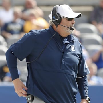 Sep 24, 2022; Pittsburgh, Pennsylvania, USA;  Rhode Island Rams head coach Jim Fleming looks on from the sidelines against the Pittsburgh Panthers during the third quarter at Acrisure Stadium. Pittsburgh won 45-24. Mandatory Credit: Charles LeClaire-Imagn Images