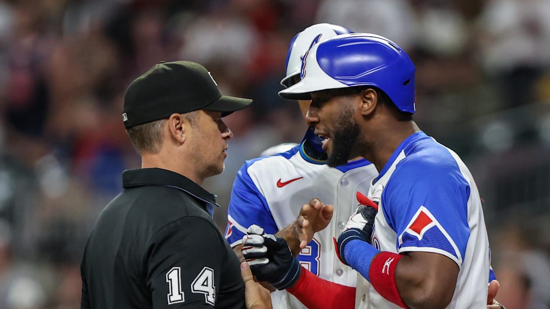 Sep 27, 2025; Cumberland, Georgia, USA; Atlanta Braves outfielder Jurickson Profar (7) speaks to umpire Mark Wegner (14) after a call in the game against the Pittsburgh Pirates during the eighth inning at Truist Park. Mandatory Credit: Jordan Godfree-Imagn Images Sep 27, 2025; Cumberland, Georgia, USA; Atlanta Braves outfielder Jurickson Profar (7) speaks to umpire Mark Wegner (14) after a call in the game against the Pittsburgh Pirates during the eighth inning at Truist Park. Mandatory Credit: Jordan Godfree-Imagn Images